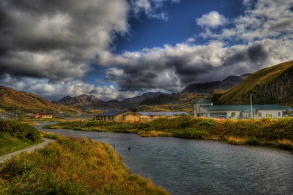Iliuliuk Creek showing Library and Senior Center - Photo by Albert Burnham